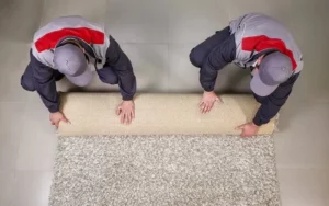 This Image Depicts Men Installing carpets