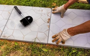 this image is about insatalling tile in out door garden